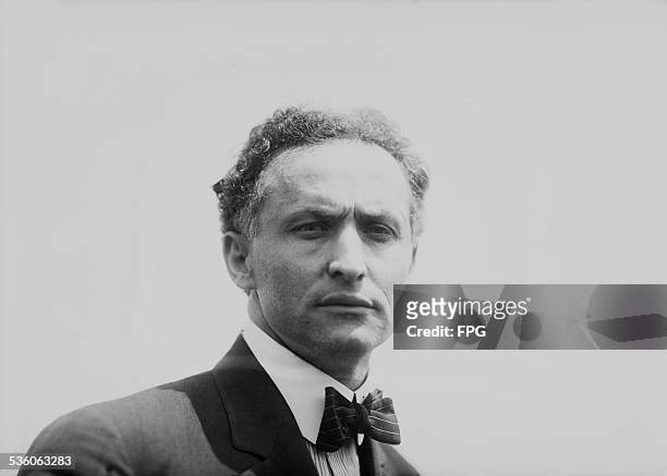 Illusionist and escape artist Harry Houdini, New York City, 7th July 1912. That same day he performed his famous stunt in which he was submerged in...