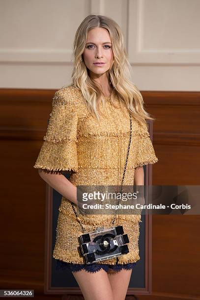Poppy Delevingne attends the Chanel show at the 'Grand Palais', as part of the Paris Fashion Week Womenswear Fall/Winter 2015/2016 on March 10, 2015...