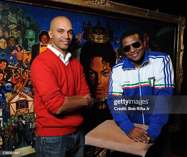 Jackie Jackson and painter/illustrator Kadir Nelson with the painting of Michael Jackson done by Nelson, December 8, 2010 in Los Angeles, California.