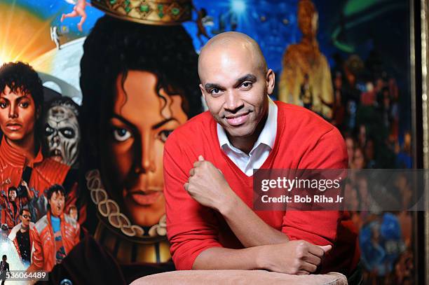 Painter/illustrator Kadir Nelson with the painting of Michael Jackson done by Nelson, December 8, 2010 in Los Angeles, California.