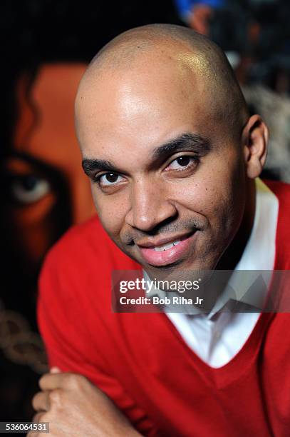 Painter/illustrator Kadir Nelson with the painting of Michael Jackson done by Nelson, December 8, 2010 in Los Angeles, California.