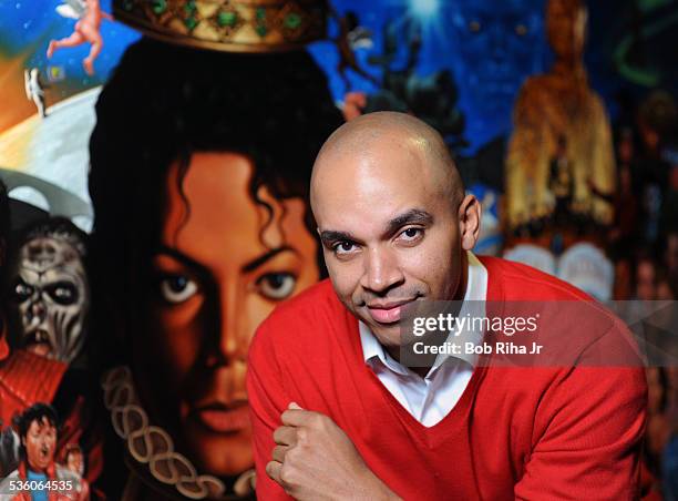 Painter/illustrator Kadir Nelson with the painting of Michael Jackson done by Nelson, December 8, 2010 in Los Angeles, California.