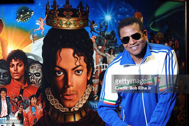 Jackie Jackson with the painting of Michael Jackson done by painter/illustrator Kadir Nelson, December 8, 2010 in Los Angeles, California.