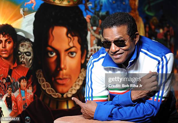 Jackie Jackson with the painting of Michael Jackson done by painter/illustrator Kadir Nelson, December 8, 2010 in Los Angeles, California.