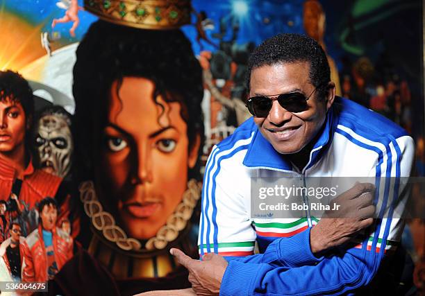Jackie Jackson with the painting of Michael Jackson done by painter/illustrator Kadir Nelson, December 8, 2010 in Los Angeles, California.