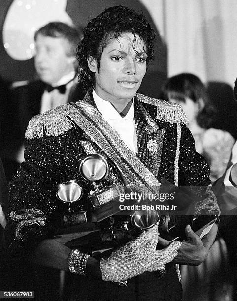 Michael Jackson with Grammy Awards he won at the 26th Annual Grammy Awards, February 28, 1984 at the Shrine Auditorium in Los Angeles, California.