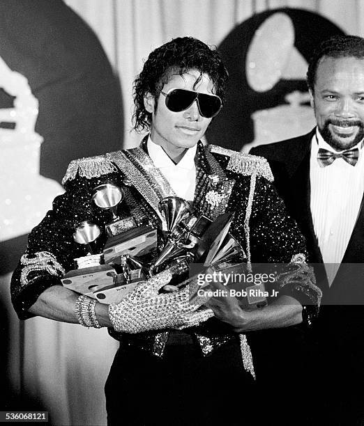 Michael Jackson with armload of Grammy Awards he won at the 26th Annual Grammy Awards, February 28, 1984 at the Shrine Auditorium in Los Angeles,...