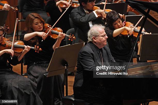 Emanuel Ax performing Chopin's "Piano Concerto in F minor" with the New York Philharmonic led by David Robertson at Avery Fisher Hall on Wednesday...