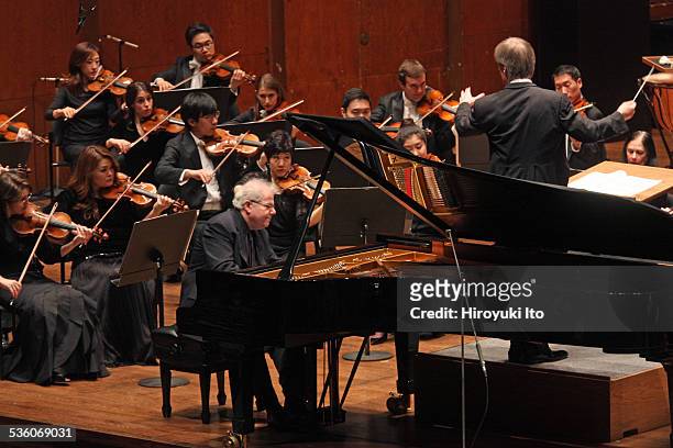 Emanuel Ax performing Chopin's "Piano Concerto in F minor" with the New York Philharmonic led by David Robertson at Avery Fisher Hall on Wednesday...