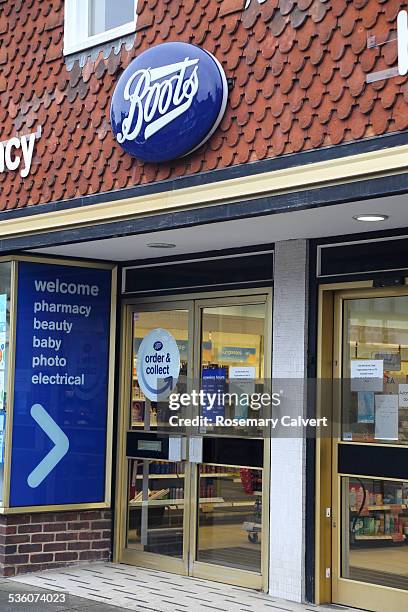 Boots sign and shop front, Haslemere High Street, Haslemere, Surrey. Boots pharmacy is U.K's leading pharmacy-led health and beauty retailer with...
