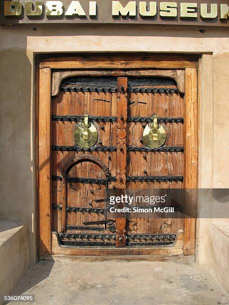 Old wooden doors of Al Fahidi Fort, Dubai's oldest building and home to the Dubai Museum, Bur Dubai, Dubai, United Arab Emirates.