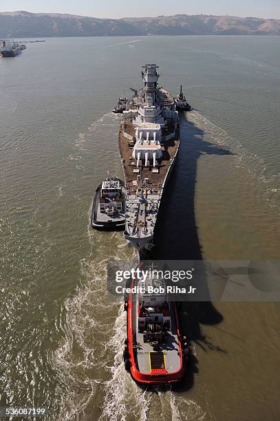 The USS Iowa - the world's last Battleship from WWII era is towed by tugboats from the Navy mothball fleet in Benicia, CA on it's 1st leg of its...