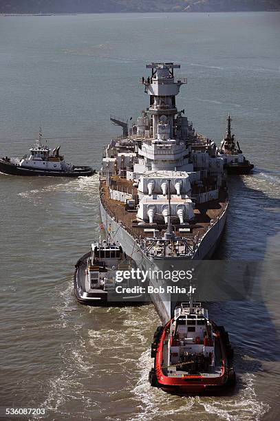 The USS Iowa - the world's last Battleship from WWII era is towed by tugboats from the Navy mothball fleet in Benicia, CA on it's 1st leg of its...