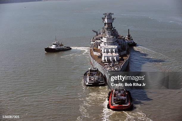 The USS Iowa - the world's last Battleship from WWII era is towed by tugboats from the Navy mothball fleet in Benicia, CA on it's 1st leg of its...