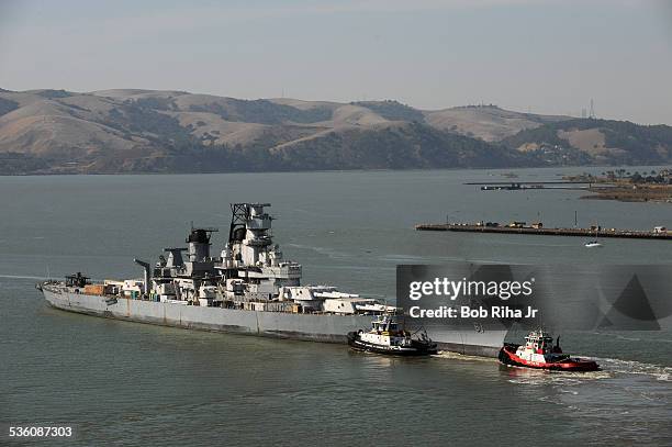 The USS Iowa - the world's last Battleship from WWII era is towed by tugboats from the Navy mothball fleet in Benicia, CA on it's 1st leg of its...