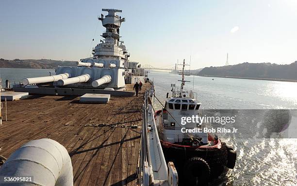The USS Iowa - the world's last Battleship from WWII era is towed by tugboats from the Navy mothball fleet in Benicia, CA on it's 1st leg of its...