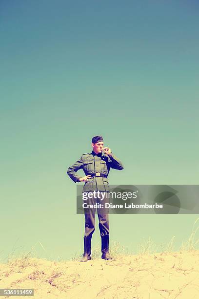 wwii german solider smoking on top of a desert hill - german wwii stock pictures, royalty-free photos & images