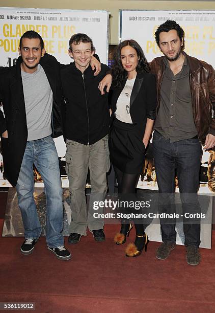 Mourade Zeguendi, Julien Courbey, Amelle Chahbi and Nader Boussandel attend the premiere of "Les Barons" in Paris.