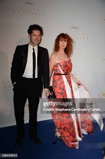 Melvil Poupaud and Sabine Azema attend the Opening Ceremony dinner during the 68th annual Cannes Film Festival on May 13, 2015 in Cannes, France.