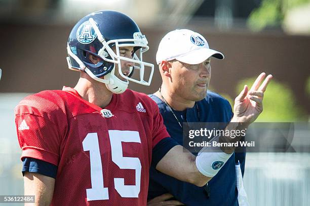 Toronto Argonauts quarterback Rickey Ray talks with coach Scott Milanovich during a practice at Guelph University. May 31, 2016.