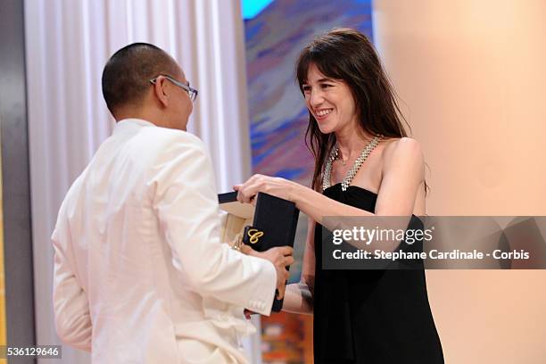 Apichatpong Weerasethakul and Charlotte Gainsbourg attend the 'Palme d'Or Award Ceremony' of the 63rd Cannes International Film Festival