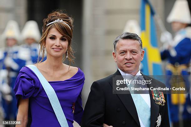 Queen Rania of Jordan and King Abdullah of Jordan attend the wedding of Crown Princess Victoria of Sweden and Daniel Westling on June 19, 2010 in...