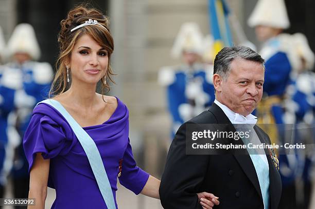 Queen Rania of Jordan and King Abdullah of Jordan attend the wedding of Crown Princess Victoria of Sweden and Daniel Westling on June 19, 2010 in...