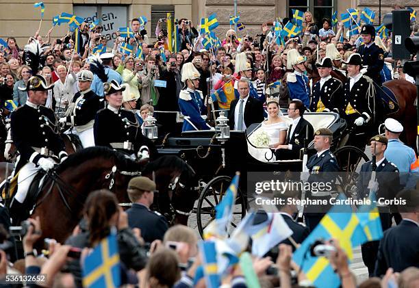 Crown Princess Victoria of Sweden, Duchess of Västergötland, and her husband Prince Daniel, Duke of Västergötland, are seen after their wedding...