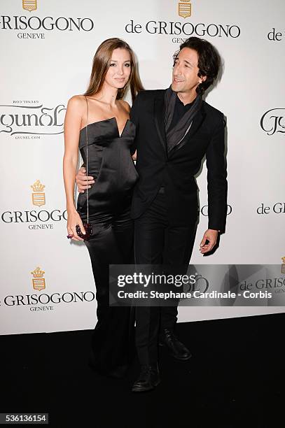 Lara Leito and Adrien Brody attends at the De Grisogono "Divine In Cannes" Dinner Party at Hotel du Cap-Eden-Roc during the 68th Cannes Film Festival