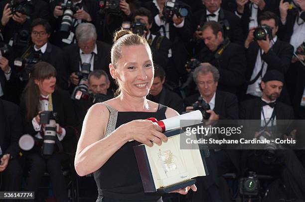 Actress Emmanuelle Bercot, winner of the Best Performance by an Actress award for her performance in 'Mon Roi' attends a photocall as winner of the...