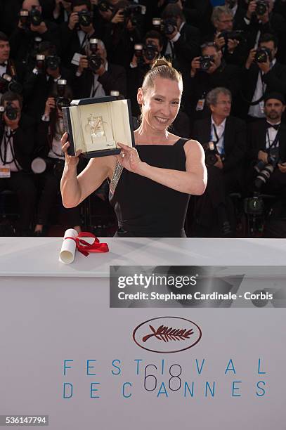 Actress Emmanuelle Bercot, winner of the Best Performance by an Actress award for her performance in 'Mon Roi' attends a photocall as winner of the...