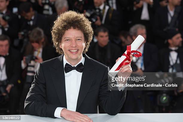 Director Michel Franco, winner of the Best Screenplay Prize for his film 'Chronic' poses at a photocall for the winners of the Palme d'Or during the...