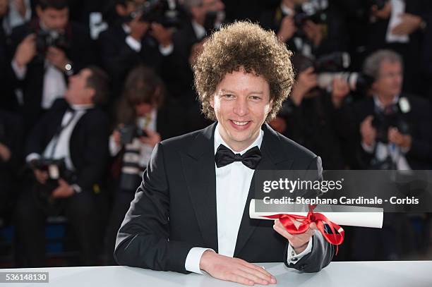 Director Michel Franco, winner of the Best Screenplay Prize for his film 'Chronic' poses at a photocall for the winners of the Palme d'Or during the...