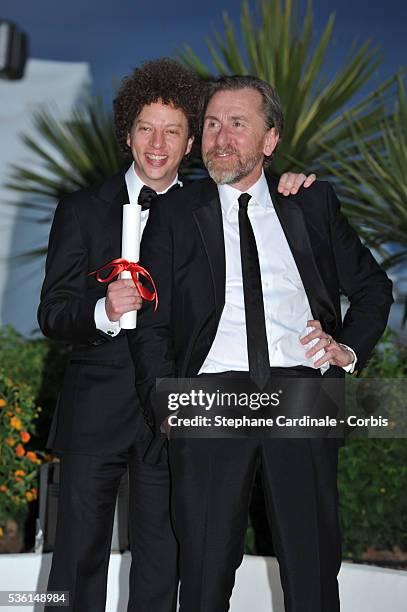 Director Michel Franco, winner of the Best Screenplay Prize for his film 'Chronic' poses with actor Tim Roth at a photocall for the winners of the...