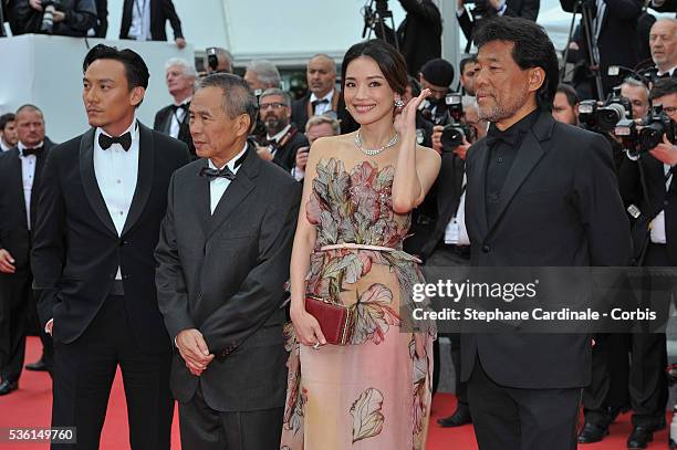 Guest, Shu Qi, Hou Hsiao-Hsien and Chang Chen attends the closing ceremony and 'Le Glace Et Le Ciel' Premiere during the 68th annual Cannes Film...