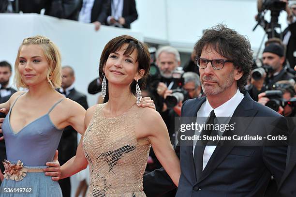 Joel Coen, Sophie Marceau, Sienna Miller attends the closing ceremony and 'Le Glace Et Le Ciel' Premiere during the 68th annual Cannes Film Festival...