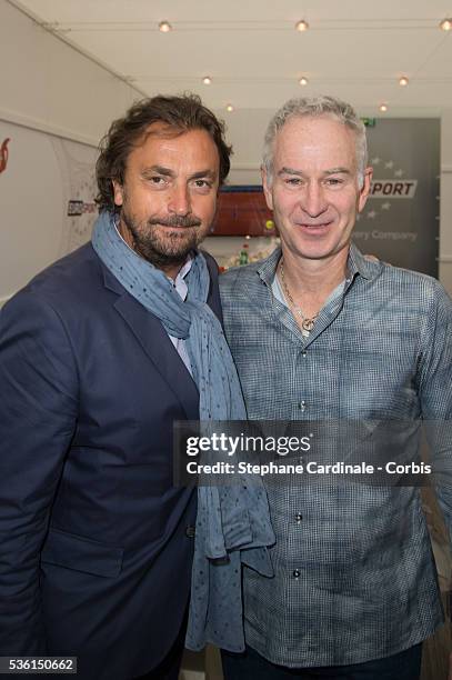 Henri Leconte and John McEnroe attend the 2015 Roland Garros French Tennis Open - Day Six, on May 26, 2015 in Paris, France.