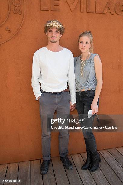 Niels Schneider and Tatiana Verstraeten attend the 2015 Roland Garros French Tennis Open - Day Seven, on May 30, 2015 in Paris, France.