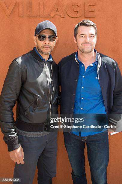 Roschdy Zem and Arnaud Ducret attend the 2015 Roland Garros French Tennis Open - Day Seven, on May 30, 2015 in Paris, France.