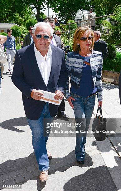 Dominique Strauss Kahn and Myriam L'Aouffir attend the 2015 Roland Garros French Tennis Open - Day Seven, on May 30, 2015 in Paris, France.