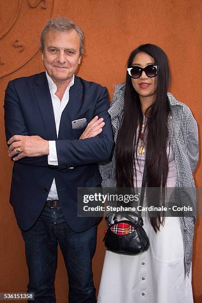 Fashion Designer, Jean-Charles de Castelbajac and his companion Jewelry Designer, Ai Canno attend the 2015 Roland Garros French Tennis Open - Day...