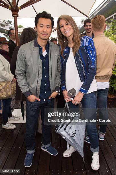 Frederic Chau and Laury Thilleman attend the 2015 Roland Garros French Tennis Open - Day Eight, on May 31, 2015 in Paris, France.