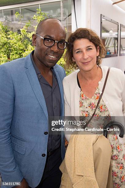 Lucien Jean-Baptiste and Isabelle Gelinas attend the 2015 Roland Garros French Tennis Open - Day Eight, on May 31, 2015 in Paris, France.