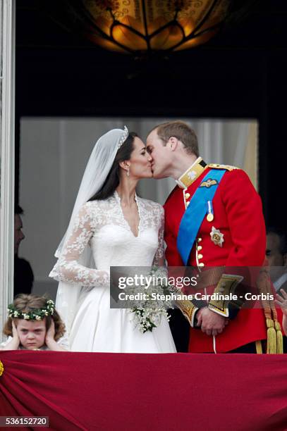 The Prince William of Wales kisses his new bride Catherine Elizabeth "Kate" on the balcony of Buckingha m Palace. The Prince and Princess of Wales...