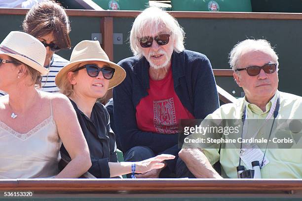 Julie Gayet and Pierre Richard attend the 2015 Roland Garros French Tennis Open - Day Twelve, on June 4, 2015 in Paris, France.
