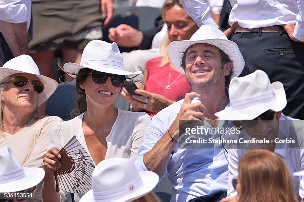 Caroline Nielsen and Patrick Bruel attend the 2015 Roland Garros French Tennis Open - Day Thirteen, on June 5, 2015 in Paris, France.