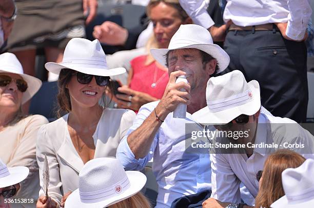 Caroline Nielsen and Patrick Bruel attend the 2015 Roland Garros French Tennis Open - Day Thirteen, on June 5, 2015 in Paris, France.