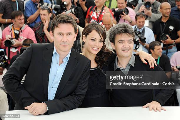 Michel Hazanavicius, Berenice Bejo and Thomas Langmann at the photo call for "The Artist" during the 64th Cannes International Film Festival.