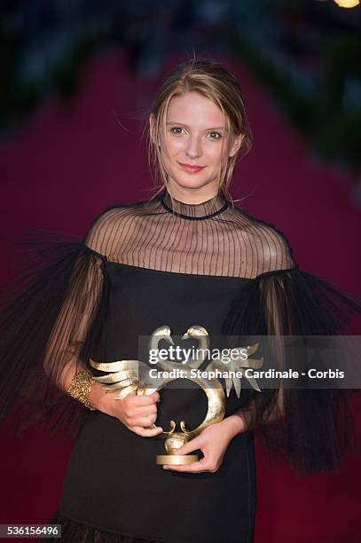 Josephine Japy poses with her prize as she was awarded Best Female Newcomer during the closing Ceremony of the 29th Cabourg Romantic Film Festival on...