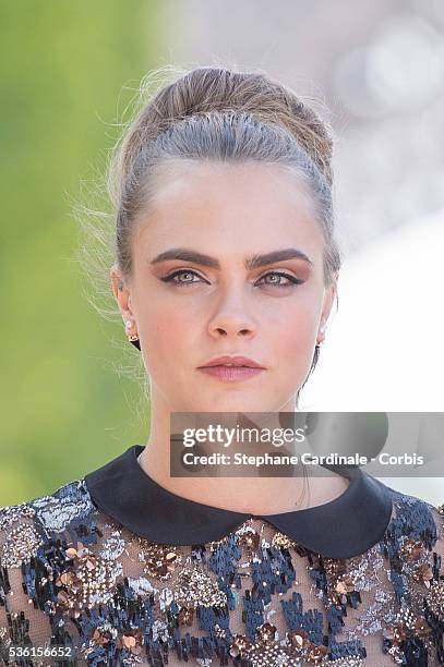 Cara Delevingne attends the photocall of the movie 'Paper Towns' on the Champs De Mars on June 17, 2015 in Paris, France.